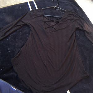 A black , long sleeve shirt with a open back